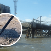 The partially collapsed pier at Rock Ferry and suspected oil spilling onto the banks of the River Mersey. Image: LDRS
