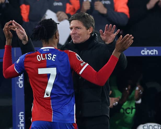 Michael Olise celebrates with manager Oliver Glasner after scoring in Crystal Palace's 4-0 win over Man Utd. (Photo by ADRIAN DENNIS/AFP via Getty Images)