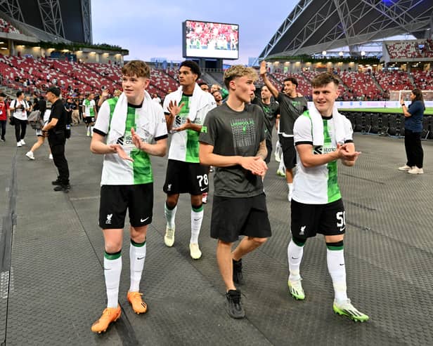 James McConnell, Bobby Clark and Ben Doak of Liverpool at the end of the pre-season friendly match between Liverpool FC and Leicester City at the National Stadium on July 30, 2023 in Singapore. (Photo by Andrew Powell/Liverpool FC via Getty Images)