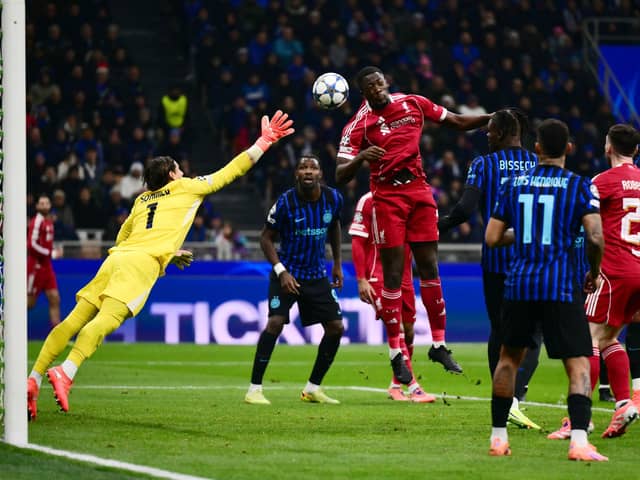 Liverpool's French defender #05 Ibrahima Konate scores goal which was ruled out by the VAR during the UEFA Champions League phase day 6 football match between Inter Milan and Liverpool at San Siro stadium in Milan, on December 9, 2025.