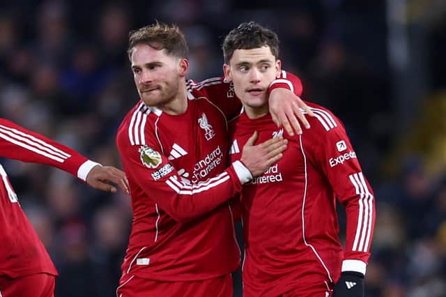 Florian Wirtz of Liverpool celebrates scoring his team's first goal with teammates Alexis Mac Allister and Cody Gakpo during the Premier League match between Fulham and Liverpool at Craven Cottage on January 04, 2026 in London, England. (Photo by Clive Rose/Getty Images)