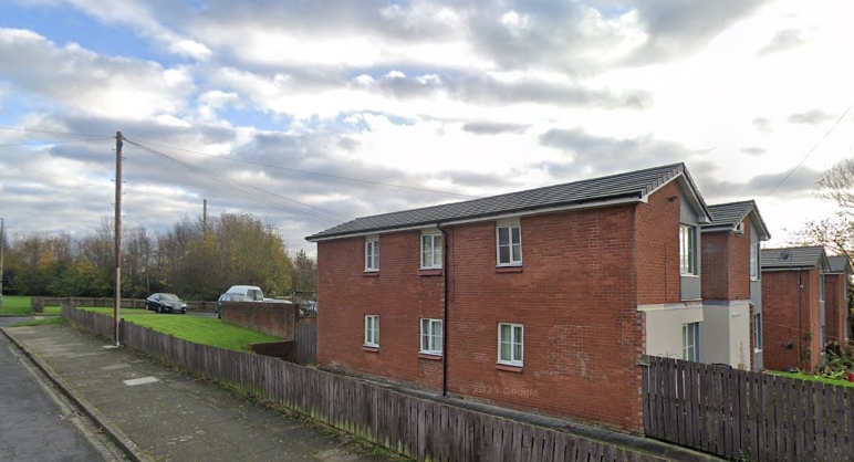Man charged with murder after body found in St Helens flat