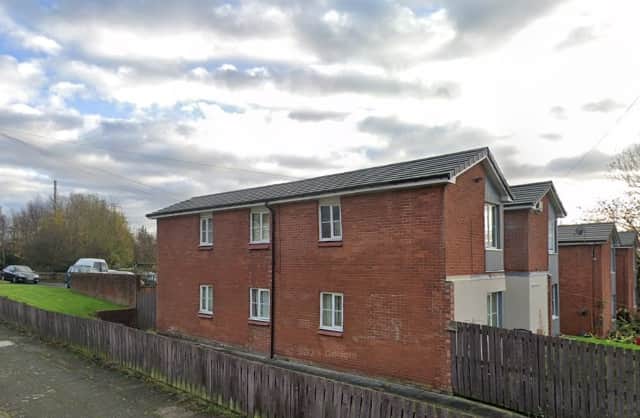 Man charged with murder after body found in St Helens flat