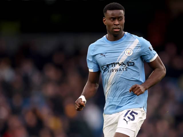 Marc Guehi in action for Man City