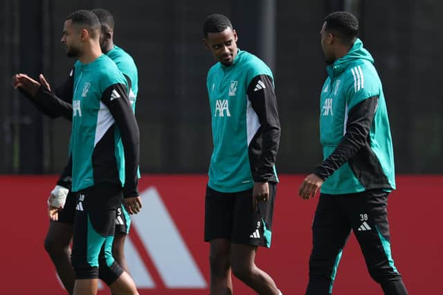 Alexander Isak of Liverpool speaks to team mate Ryan Gravenberch during the Liverpool FC Training Session and Press Conference ahead of their UEFA Champions League 2024/25 Quarter-Finals First Leg match against Paris Saint-Germain at AXA Training Centre on April 07, 2026 in Kirkby, England. (Photo by Jan Kruger/Getty Images)
