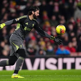 Liverpool goalkeeper Alisson Becker kicks the ball out of his hands