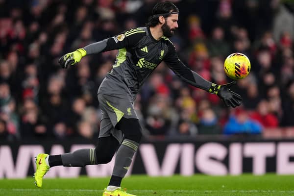 Liverpool goalkeeper Alisson Becker kicks the ball out of his hands