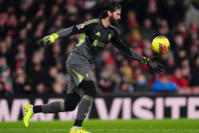 Liverpool goalkeeper Alisson Becker kicks the ball out of his hands