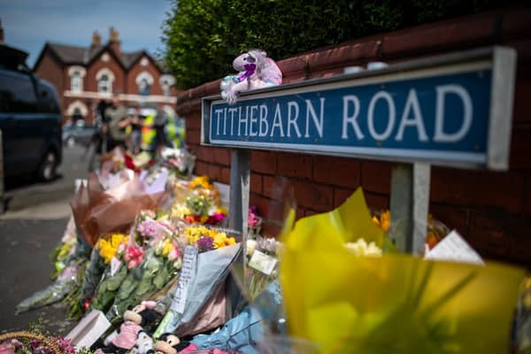 Flowers and tributes near the scene in Hart Street, Southport, where three children died and eight were injured in the knife attack 