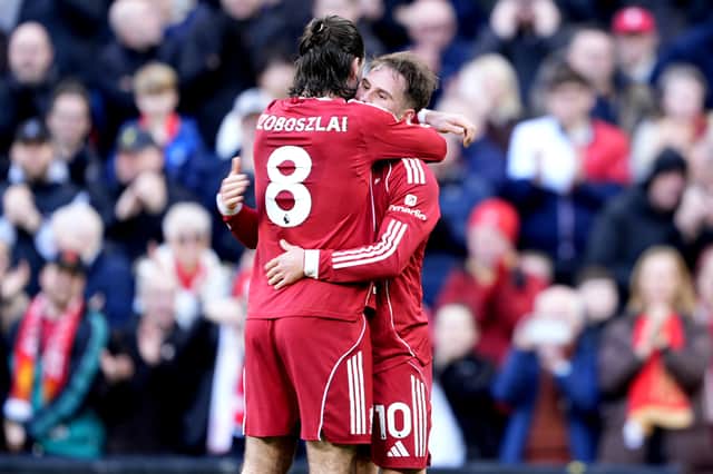 Liverpool's Alexis Mac Allister celebrates scoring his sides third goal with Dominik Szoboszlai.
