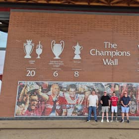 Mark Temple with his support team outside Anfield