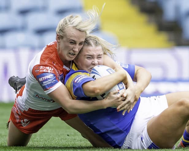 St Helens's Jodie Cunningham tackles Leeds's Zoe Hornby. Picture: Allan McKenzie/SWpix.com