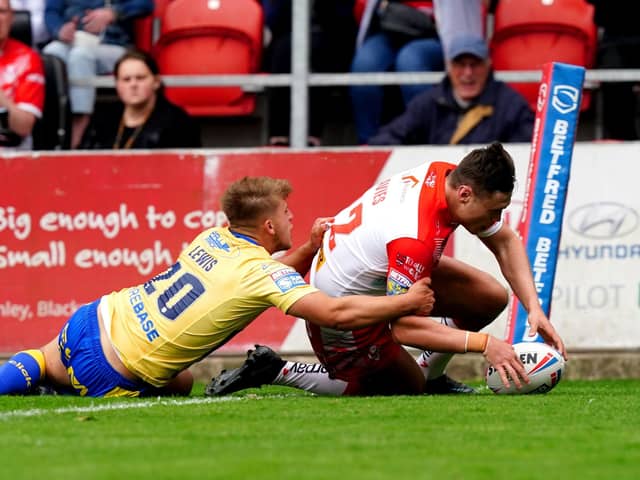 St Helens' Ben Davies scores a try against Hull KR. Picture: PA