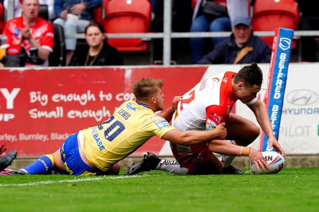 <p>St Helens' Ben Davies scores a try against Hull KR. Picture: PA</p>