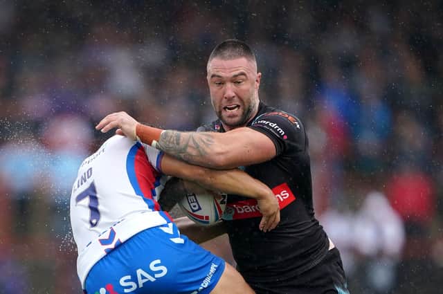 Impact: Wakefield Trinity's Mason Lino tackles St Helens' Curtis Sironen. Picture: Zac Goodwin/PA Wire.