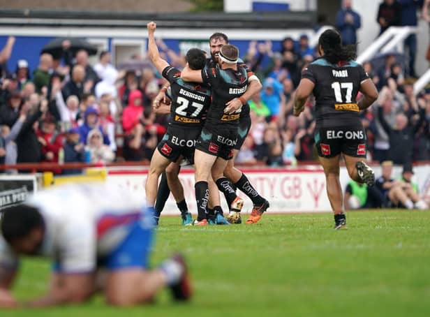 Golden moment: St Helens players celebrate Jack Welsby's golden point drop goal. Pictures: Zac Goodwin/PA Wire.