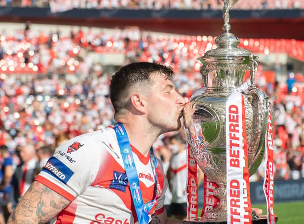 <p>Mark Percival kisses the Challenge Cup trophy after St Helens' victory in 2021. (Picture: SWPix.com)</p>