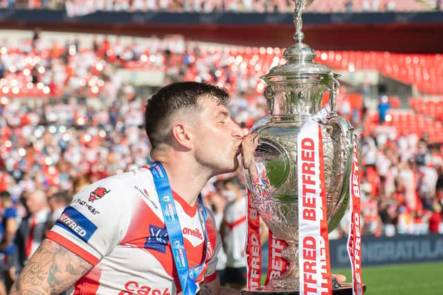 <p>Mark Percival kisses the Challenge Cup trophy after St Helens' victory in 2021. (Picture: SWPix.com)</p>