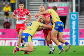 St Helens' James Roby is tackled by Hull KR's George King and Jimmy Keinhorst. Picture by Alex Whitehead/SWpix.com