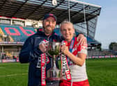 St Helens coach Derek Hardman and captain Jodie Cunningham with the Betfred Women's Super League trophy after victory over Leeds. Picture: SWPix