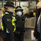 Prime Minister Boris Johnson talks to British Transport Police officers at Liverpool Lime Street as part of 'Operation Toxic' to infiltrate County Lines drug dealings on December 6. Photo by Christopher Furlong/Getty Images.