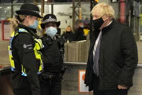 Prime Minister Boris Johnson talks to British Transport Police officers at Liverpool Lime Street as part of 'Operation Toxic' to infiltrate County Lines drug dealings on December 6. Photo by Christopher Furlong/Getty Images.