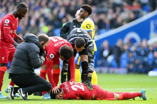 Luis Diaz was hurt after colliding with Brighton goalkeeper Robert Sanchez, whilst heading Liverpool into a first-half lead (Photo by Mike Hewitt/Getty Images)