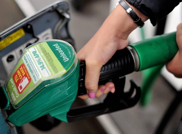 <p>File photo dated 15/08/13 of a person using a petrol pump: Nick Ansell/PA Wire</p>