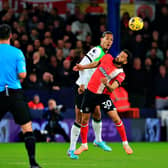 Andros Townsend goes up for the ball with Liverpool's Virgil van Dijk on Sunday - pic: Liam Smith