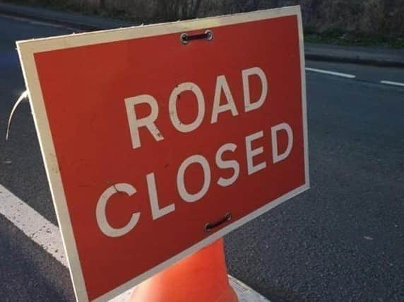 Police have closed the A580 near to Carr Mill Dam, St Helens 