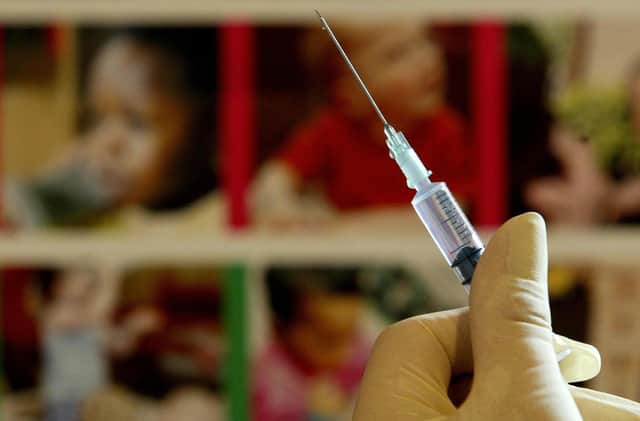 File photo dated 10/08/24 of a nurse handling a syringe at a medical centre in Ashford, Kent. Millions of parents in England are being urged to book their children in for missed measles, mumps, and rubella (MMR) jabs, amid a "very real risk" of measles outbreaks across the country. Officials said the decline in the uptake of routine childhood vaccinations is a "serious concern". Issue date: Monday January 22, 2024.