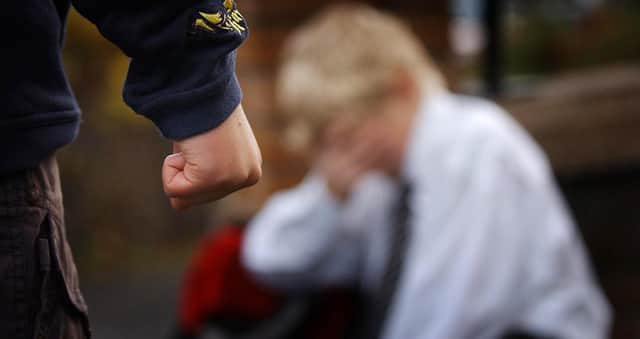 PA file photo dated 18.11 2006 showing a posed image simulating a child being bullied.