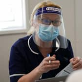 An NHS nurse in Liverpool in PPE during COVID-19. 