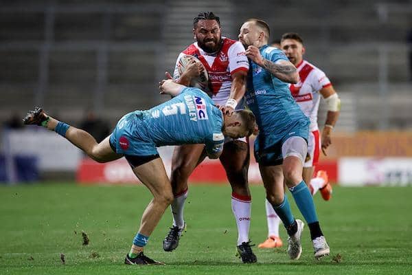 St Helens' Konrad Hurrell - who was sent-off in the closing moments - is tackled by Rhinos' Ash Handley ND Blake Austin  in the first half of Friday's game. Picture by Paul Currie/SWpix.com.