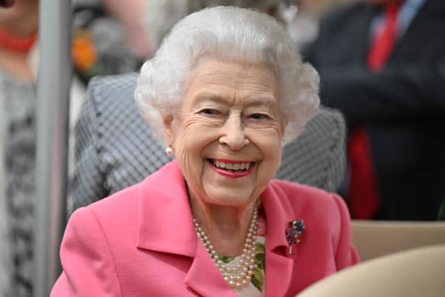 Queen Elizabeth II smiles during a visit to the 2022 RHS Chelsea Flower Show in London.