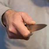 File photo dated 16/01/20 of a model poses holding a knife. Metropolitan Police Commander Alex Murray told the PA news agency that, while overall homicide figures in the English capital have dropped, the number of teen deaths has risen. Issue date: Tuesday July 27, 2021.