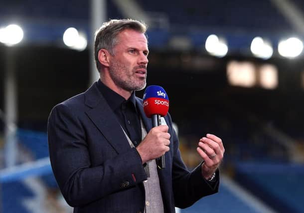 Jamie Carragher speaks for Sky Sports. (Photo by Peter Powell/Pool via Getty Images)