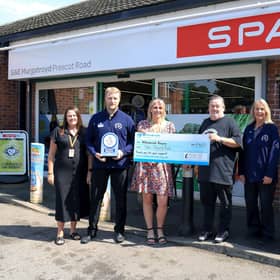Members of the SPAR Prescot Road team are joined by Johnny Vegas and Bev Neilson from Willowbrook Hospice.
