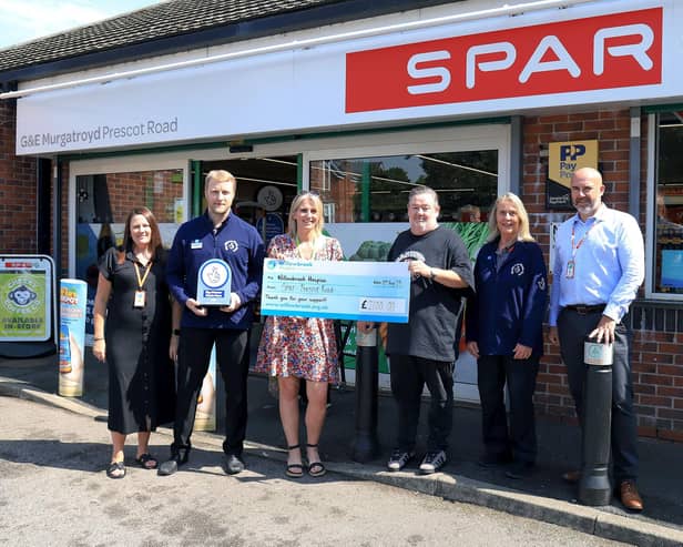 Members of the SPAR Prescot Road team are joined by Johnny Vegas and Bev Neilson from Willowbrook Hospice.