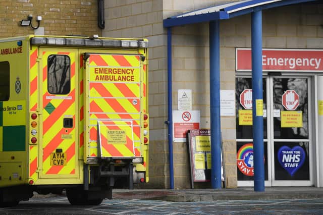 An ambulance outside an entrance to Southend University hospital in Essex. Hospitals in the county have declared a major incident and local authorities, concerned about the number of Covid-19 cases, have asked for military help to increase hospital capacity, with fears over critical care, bed capacity and staff sickness.