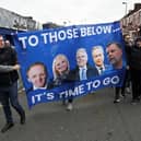 UNPOPULAR: Everton fans protests forced the departures of Grant Ingles, Denise Barrett-Baxendale (left and second left) and Graham Sharp (far right) - all pictured on this banner - as directors. Owner Farhad Moshiri is second from the right