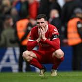 Scotland captain Andy Robertson slumps to the turf after Liverpool's 1-0 defeat to Crystal Palace at Anfield. (Photo by PAUL ELLIS/AFP via Getty Images)