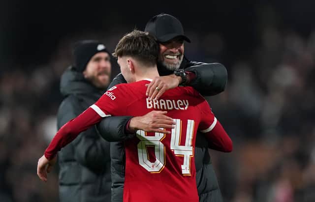 Liverpool manager Jurgen Klopp embraces Conor Bradley. 