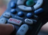 Netflix is launching the sub-account model soon, and a cheaper subscription package next month. Picture: Chris DELMAS/AFP via Getty Images.
