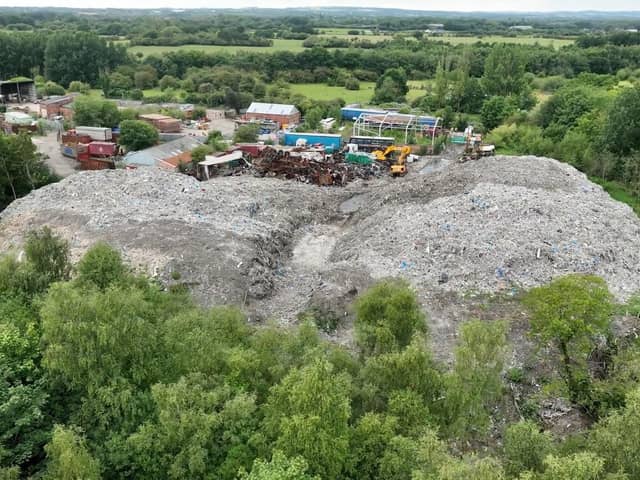 The waste piled high on Bolton House Road, Bickershaw