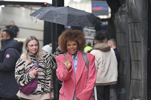 Strictly cast arrive at the Blackpool Tower  in the heavy rain