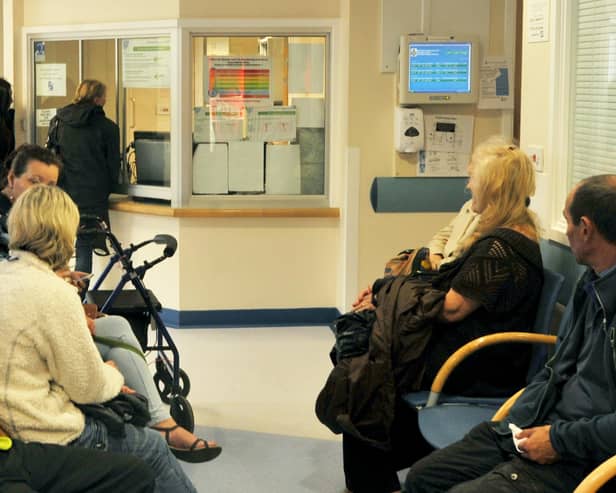 Patients in a GP waiting room.