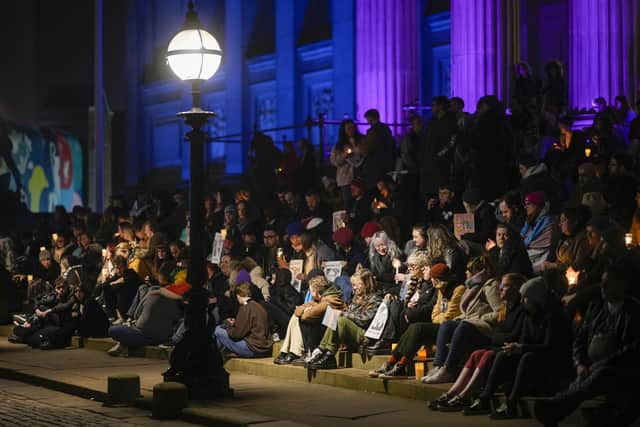 People attend a candlelit vigil in memory of the 16-year-old on February 14 in Liverpool. A number of similar vigils are being held in cities across the country.