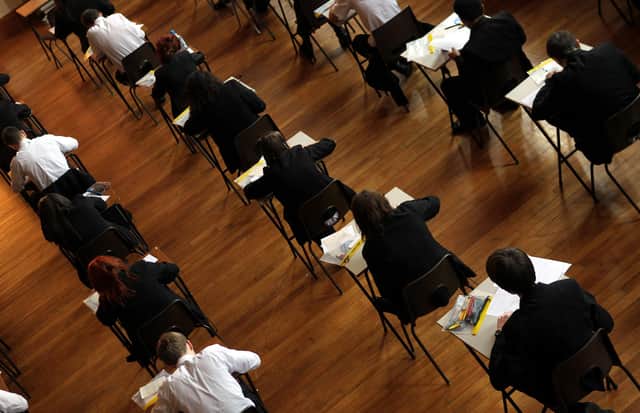 File photo dated 02/03/2012 of a exam in progress. Bedales School a private school in Hampshire is cutting the number of GCSEs pupils can take because the qualification is "outdated" and not fit for purpose, the headteacher Will Goldsmith has said.