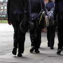 Pupils in Year 7 and above have been advised to wear masks in communal areas like corridors. Whether they wear them in classrooms will be up to schools.